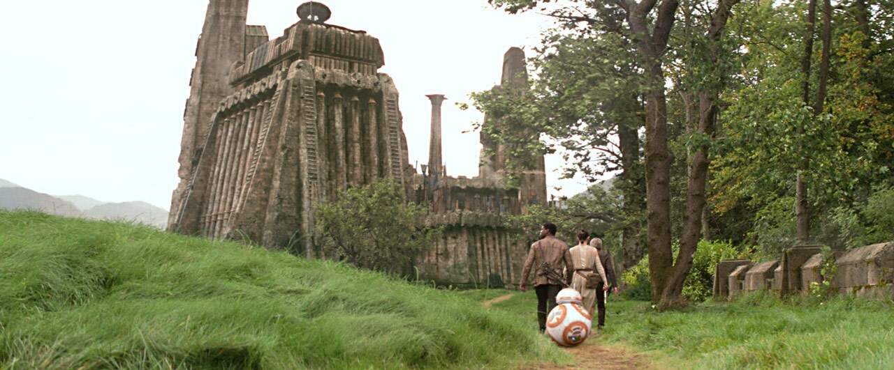 Rey, Finn, and BB-8 follow Han Solo into Maz's castle.