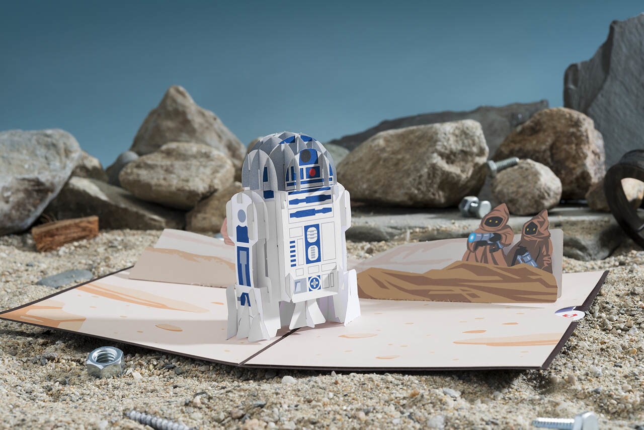A Star Wars Lovepop card featuring R2-D2 in the desert.