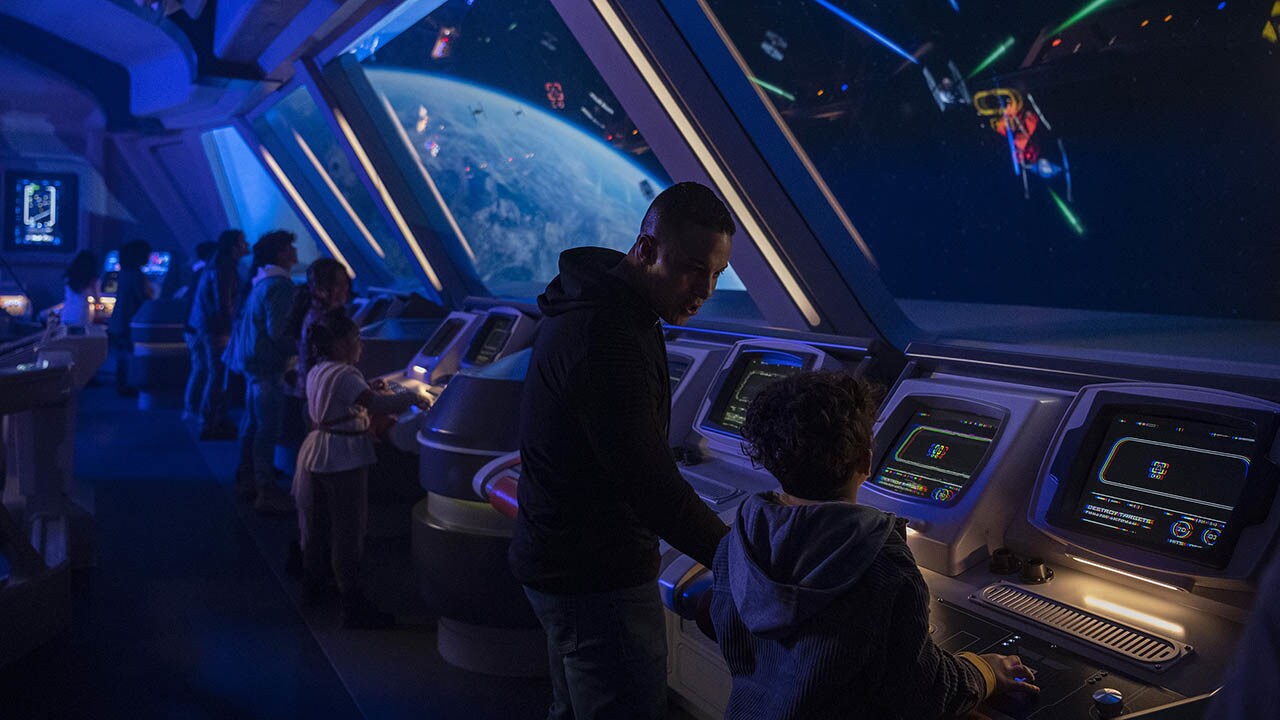 Passengers defend the Halcyon starcruiser from the ship’s Bridge in Star Wars: Galactic Starcruiser at Walt Disney World Resort in Lake Buena Vista, Fla. (Matt Stroshane, photographer)