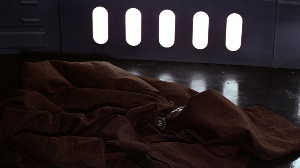 Obi-Wan Kenobi's empty cloak and lightsaber on the floor of the Death Star.