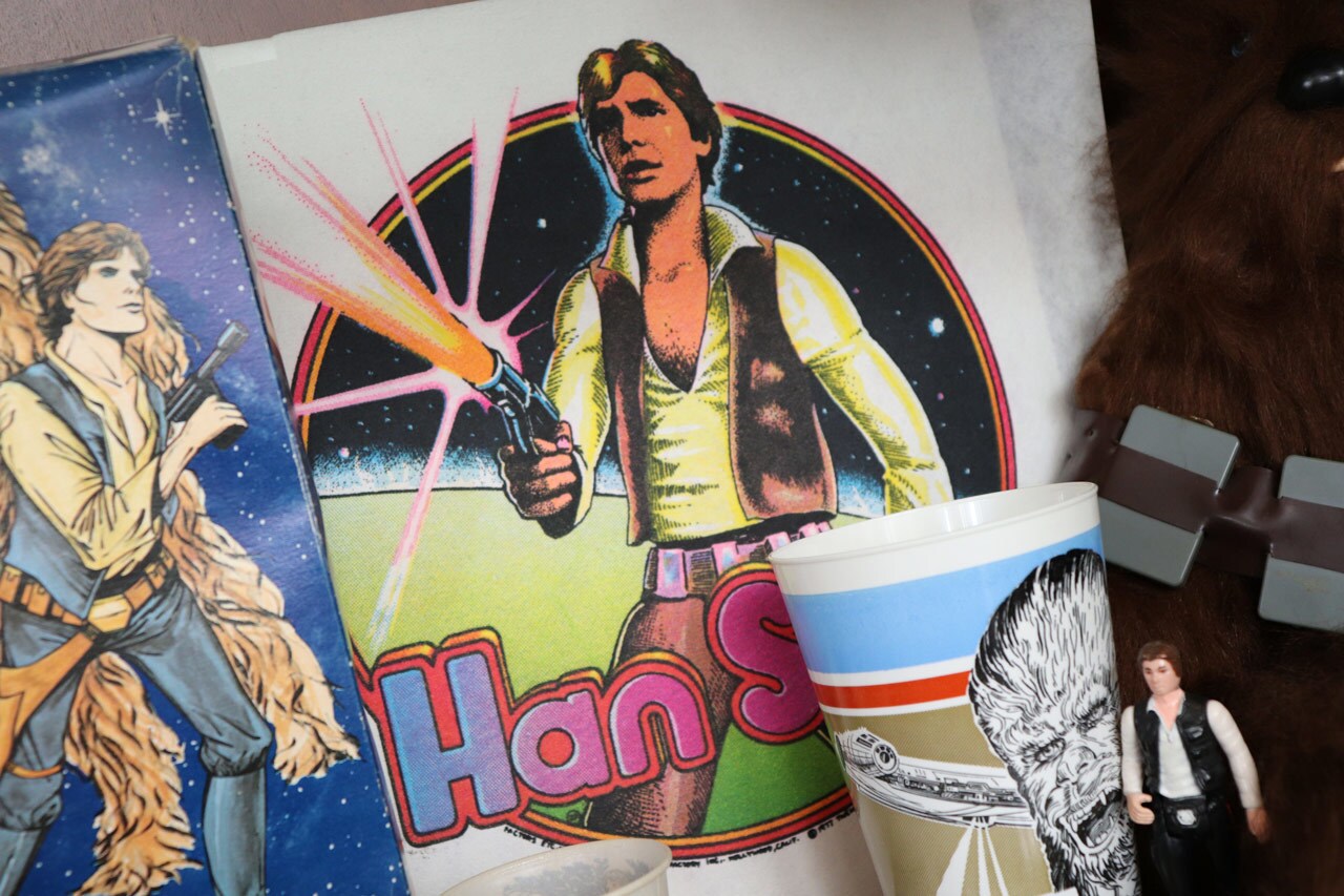 A Han Solo t-shirt transfer image from the 1970s, surrounded by other Star Wars merchandise.
