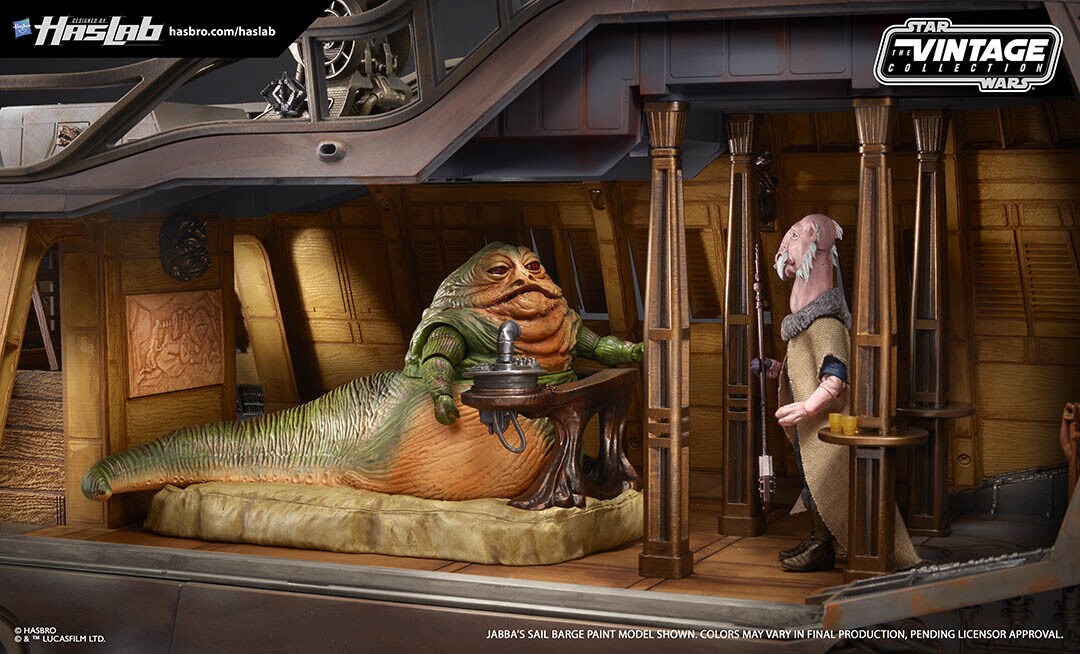 Jabba the Hutt and Saelt-Marae action figures face each other aboard a HasLab Jabba's Barge toy set.