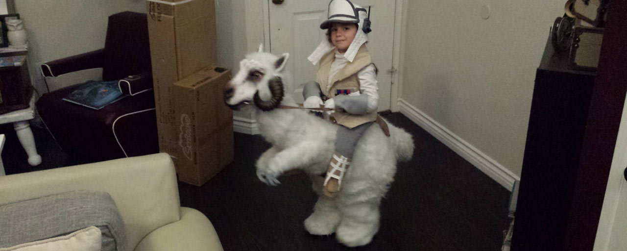 A young boy in a homemade Tauntaun costume.