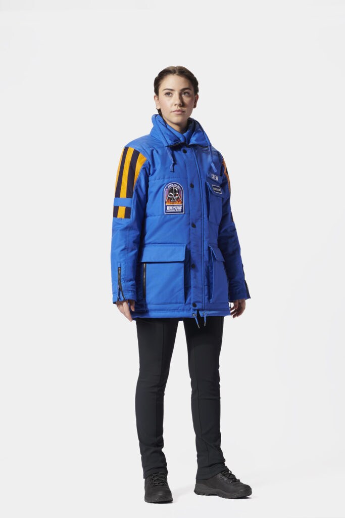 A female model sporting the Star Wars: Empire Crew Parka.