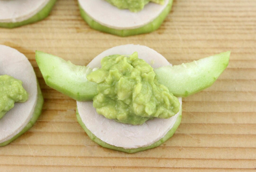 Steps to make Yoda Cucumber Bites.
