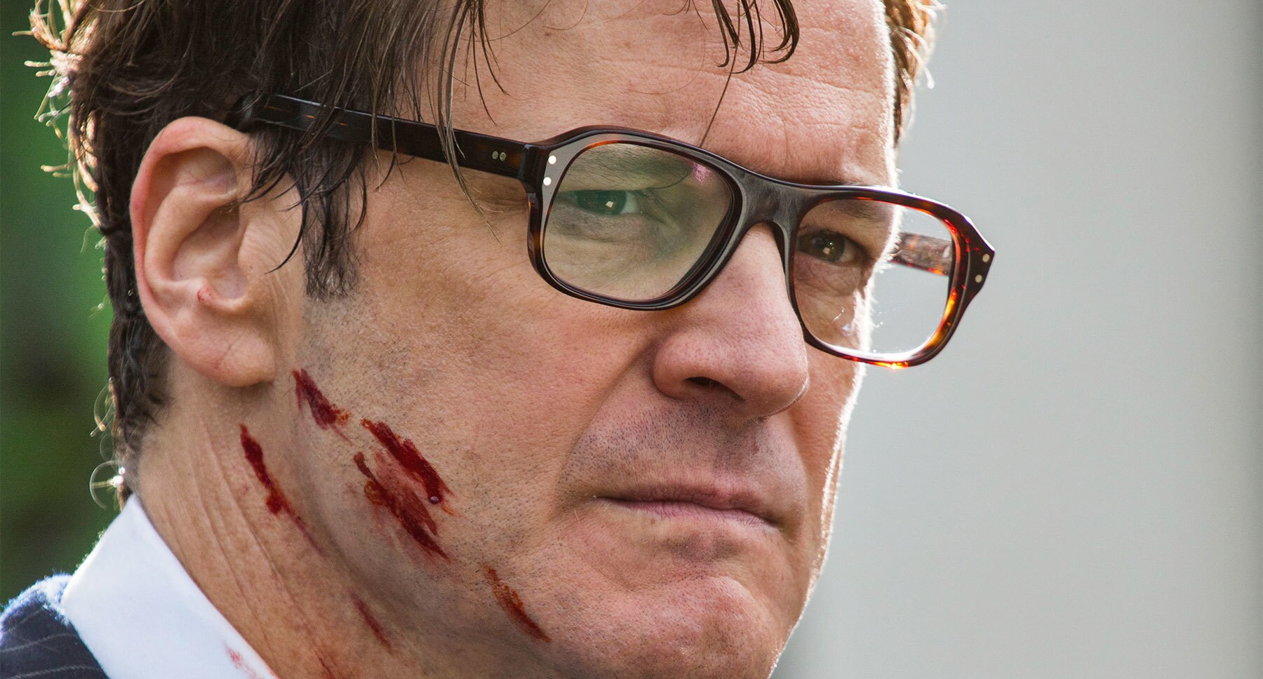 Colin Firth (Galahad) with a blood on his face in "Kingsman: The Secret Service"