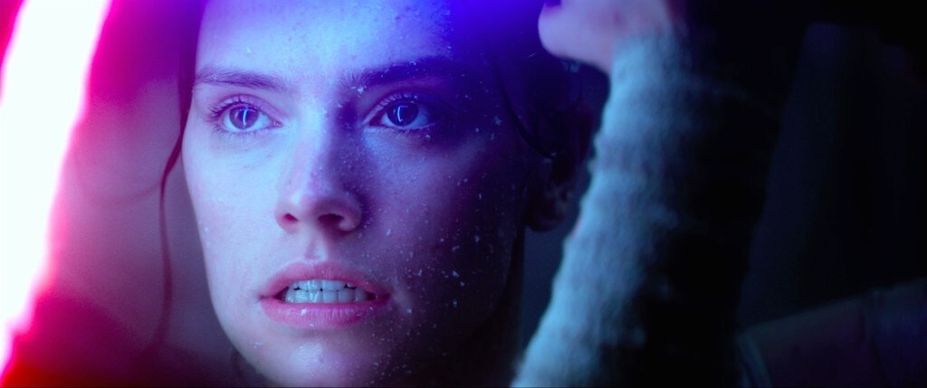 Rey blocks Kylo Ren's lightsaber, during a duel in The Force Awakens.