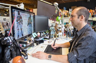 Brian Ewing,senior designer for Disney Store, at work on Star Wars toys