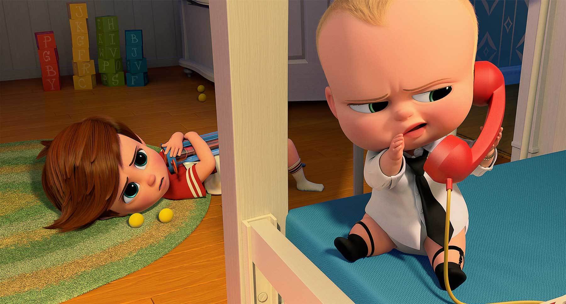 Miles Bakshi (as Tim Templeton) and Alec Baldwin (on the phone as The Boss Baby) in the animated movie "The Boss Baby"