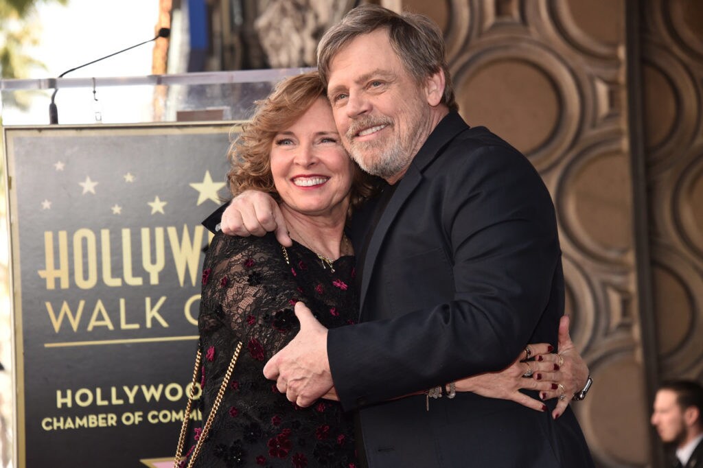 Mark Hamill hugs a woman at the unveiling of his Hollywood Walk of Fame Star.