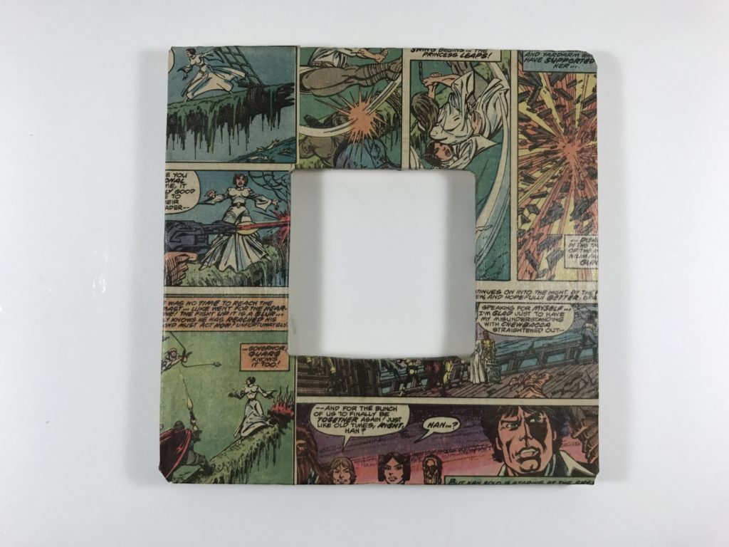 A wooden picture frame wrapped in Star Wars comic book pages.
