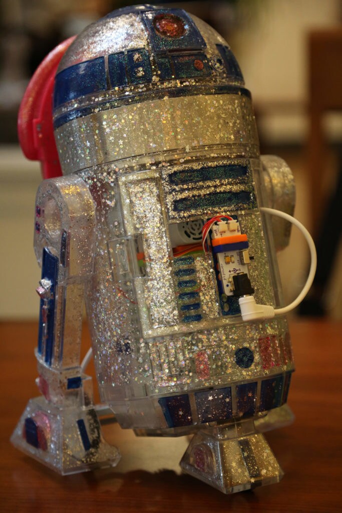 A littleBits Droid R2-D2 covered in glitter.