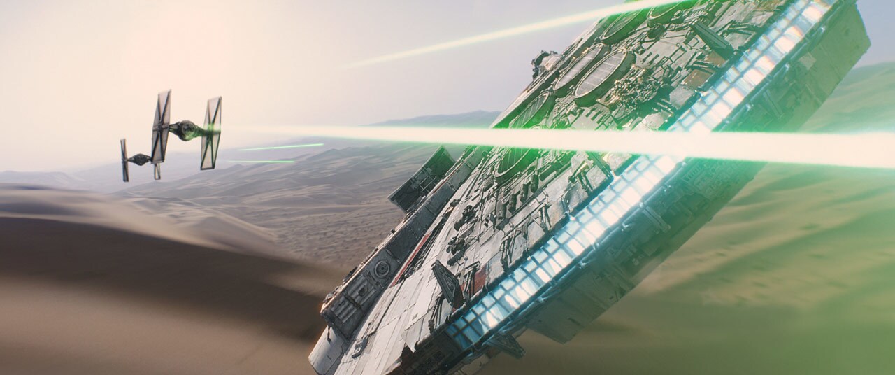 TIE fighters fire at the Millennium Falcon in The Force Awakens.