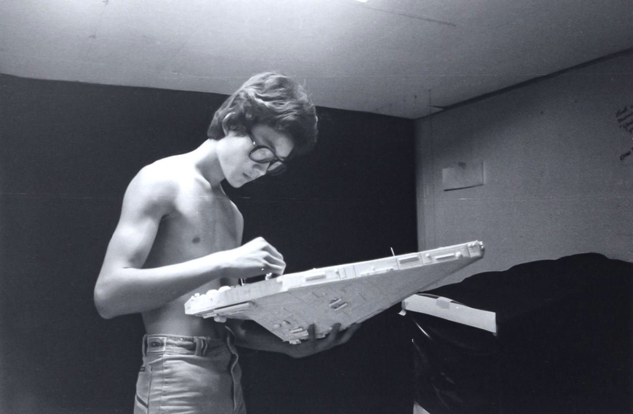 Doug Chiang works on a spaceship made from poster board and model part kits for his film Side One. 