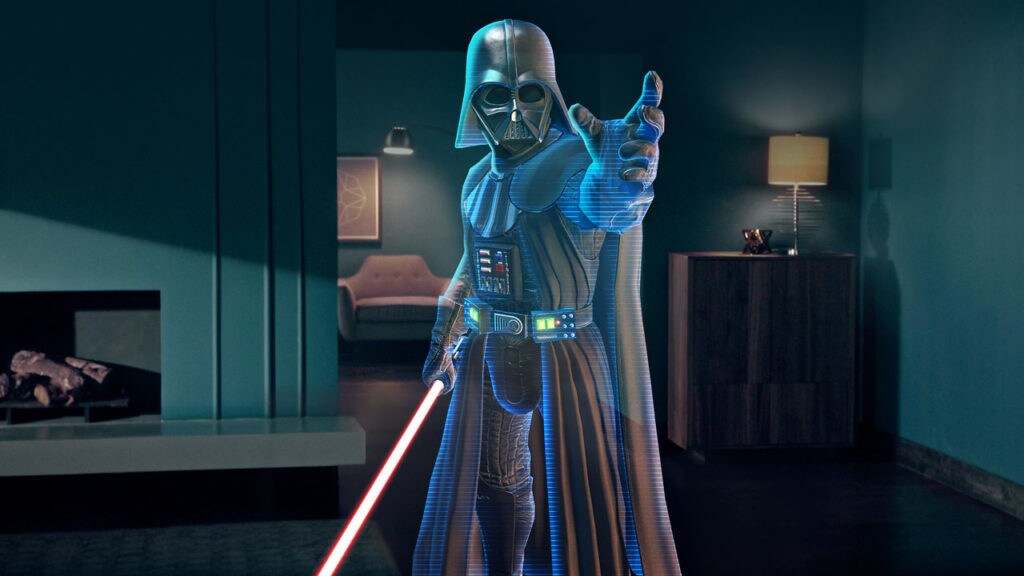 Darth Vader holds his lightsaber while extending a hand to Force-choke in the Jedi Challenges AR game.
