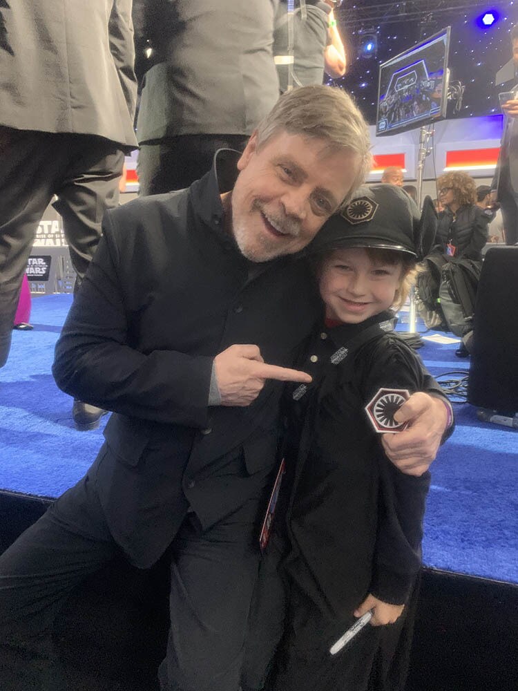 Mark Hamill poses with a young fan.