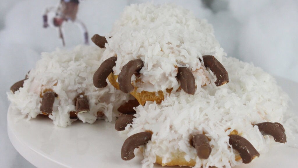 Donuts shaped like Wampa Arms with coconut fur and chocolate pretzel claws.