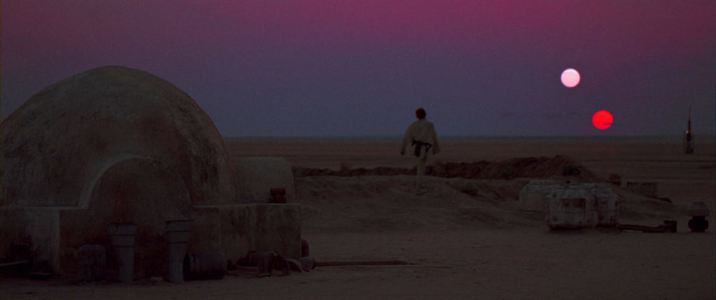 Luke Skywalker looks out over the twins suns of Tatooine.