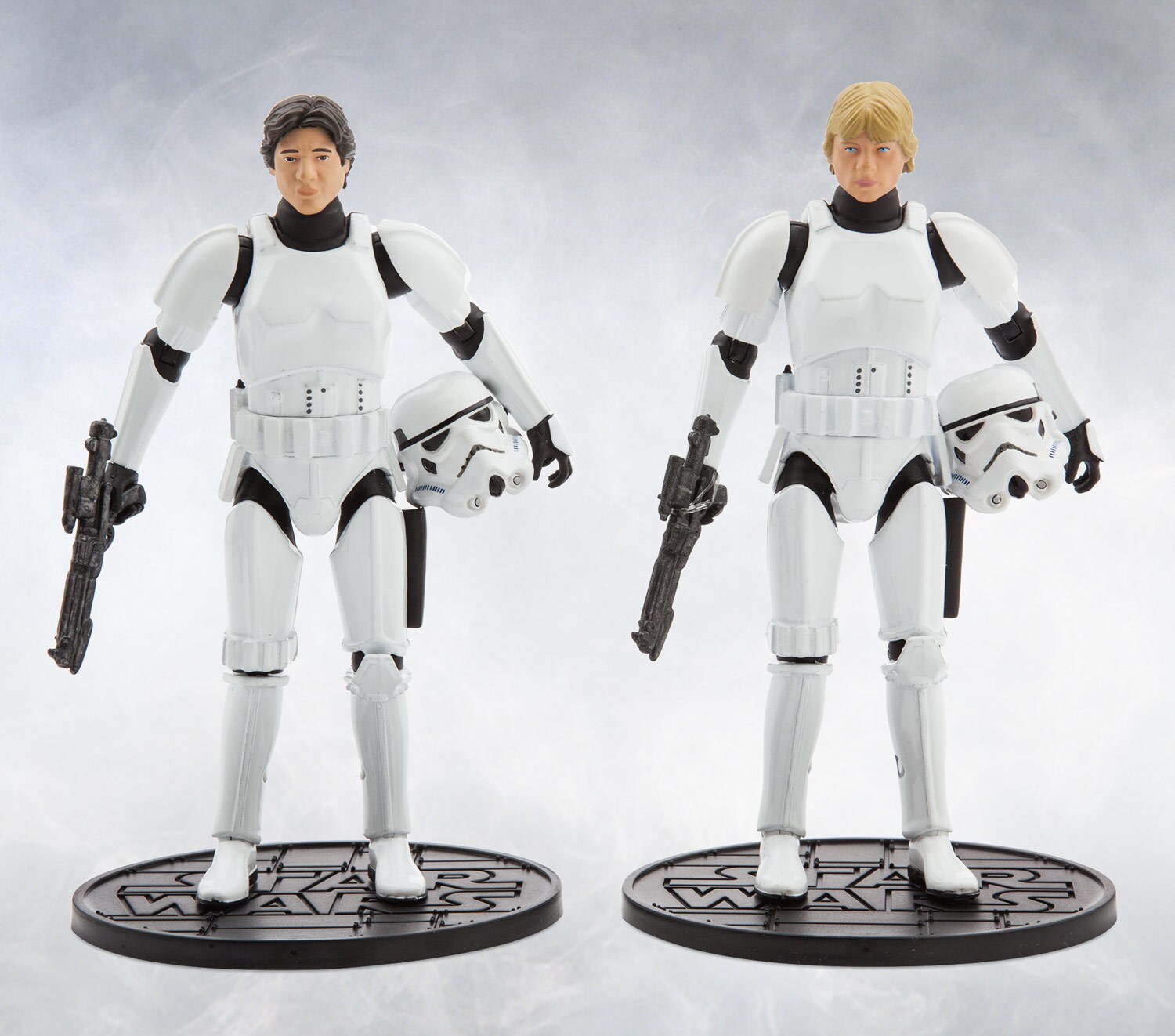Figurines of Han and Luke in stormtrooper armor.