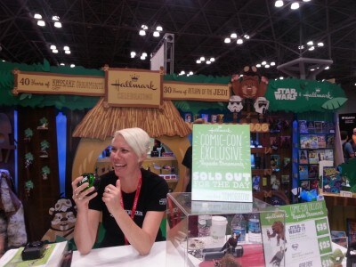 A person works at a Star Wars display at the New York Comic Convention.