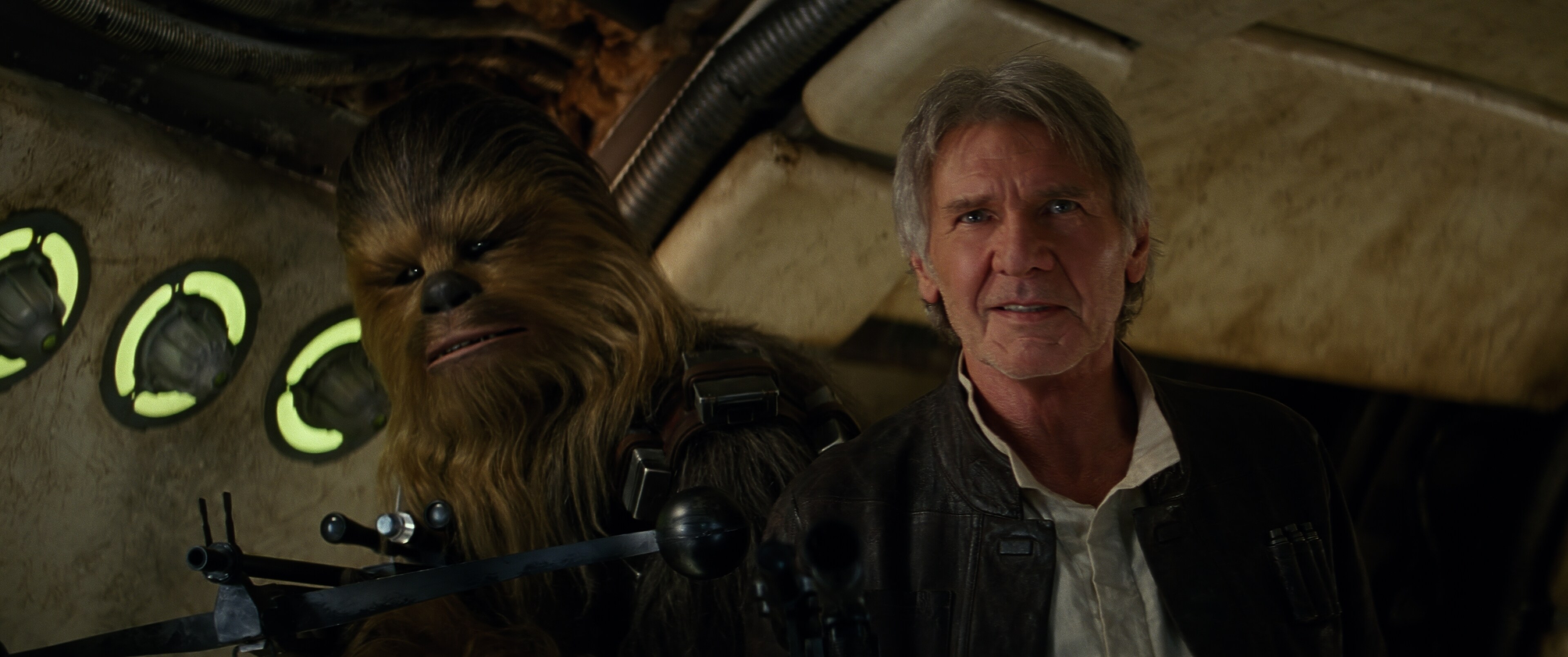 Joonas Suotamo as Chewbacca and Harrison Ford as Han Solo on the Millennium Falcon from the movie, "Star Wars: The Force Awakens."