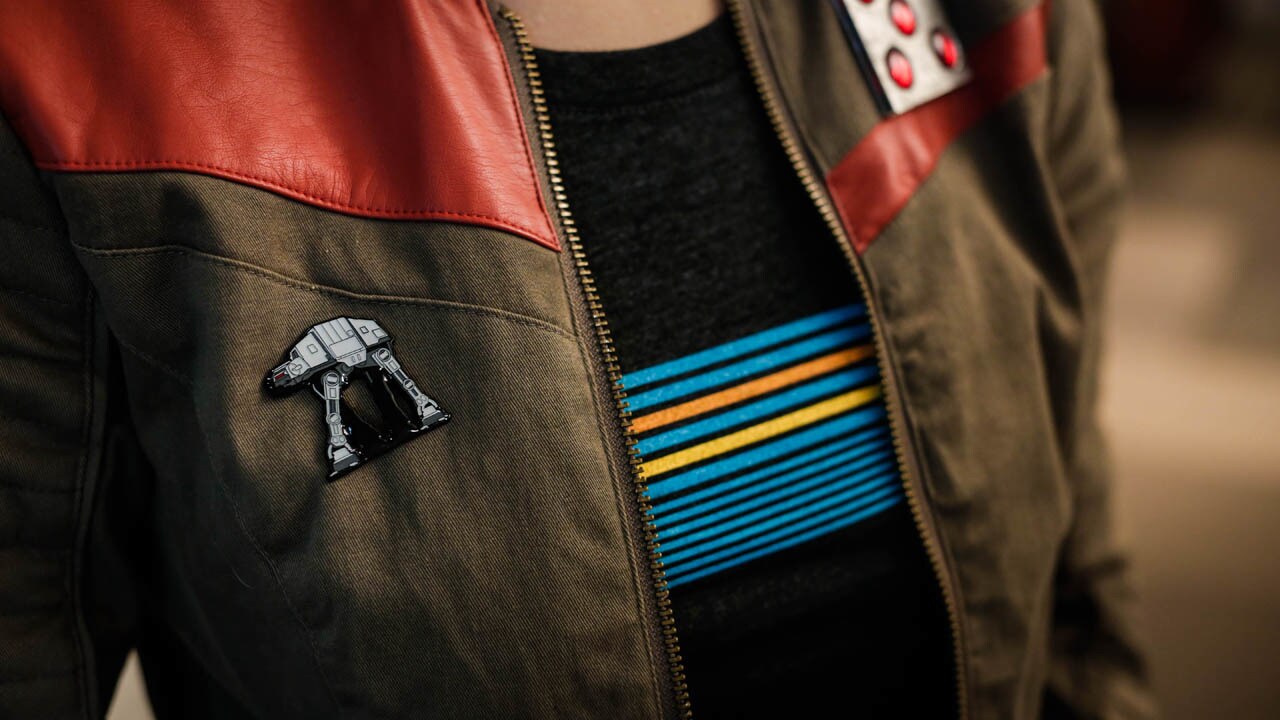 A Star Wars fan wears an enamel pin of an Imperial Walker.