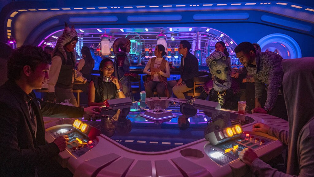 Passengers enjoy the Sublight Lounge onboard the Halcyon starcruiser in Star Wars: Galactic Starcruiser at Walt Disney World Resort in Lake Buena Vista, Fla. (Matt Stroshane, photographer)