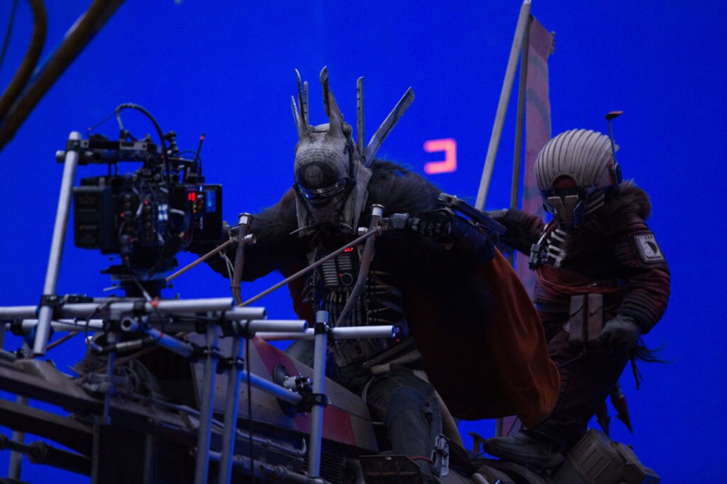 Behind-the-scenes shot of Enfys Nest on her swoop bike in Solo: A Star Wars Story.