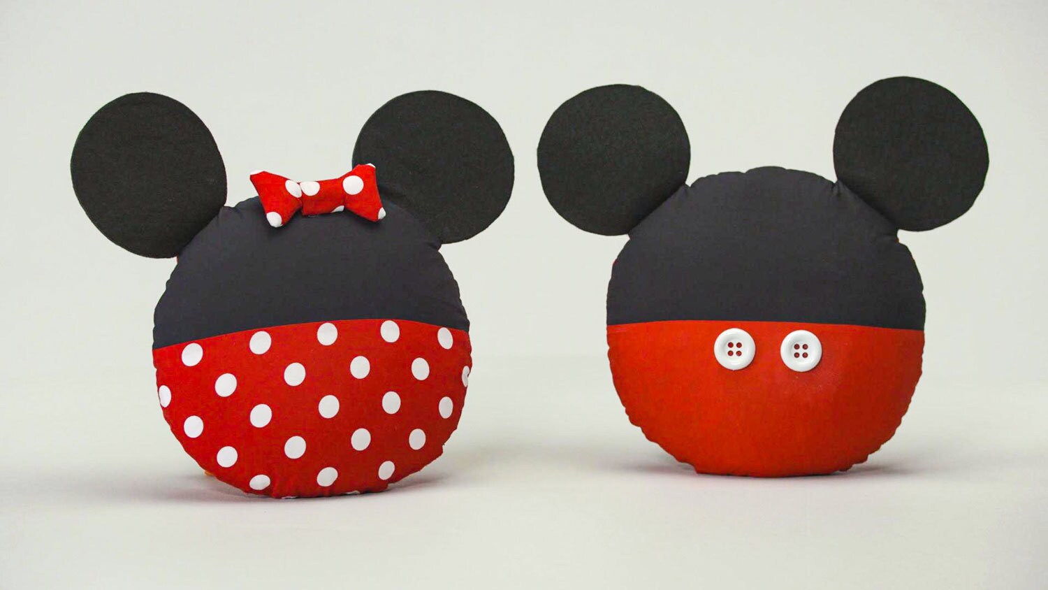 Mickey and Minnie Mouse themed pillows, complete with ears.