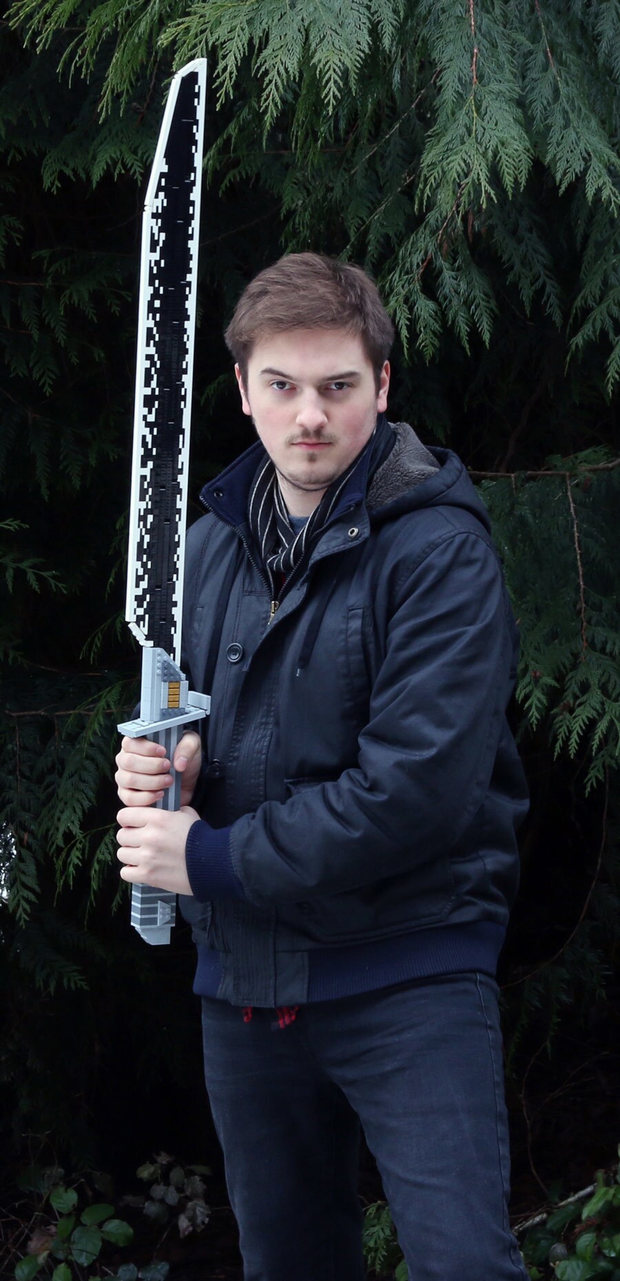Fan Taylor Walker poses with his homemade Lego Darksaber.