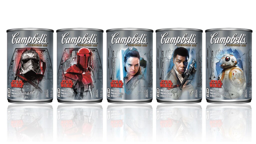 A collection of Campbell's soup cans decorated with Captain Phasma, Rey, Finn, BB-8, and a Praetorian Guard.