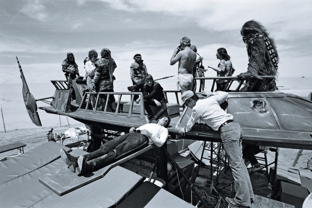 Harrison Ford rests on the plank of Jabba's sail barge, photo from the book Star Wars Icons: Han Solo.