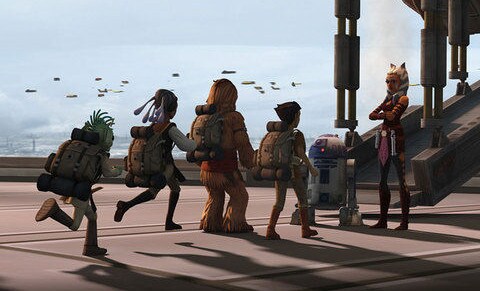 Ahsoka and R2-D2 greet a line of younglings in an episode of Clone Wars.