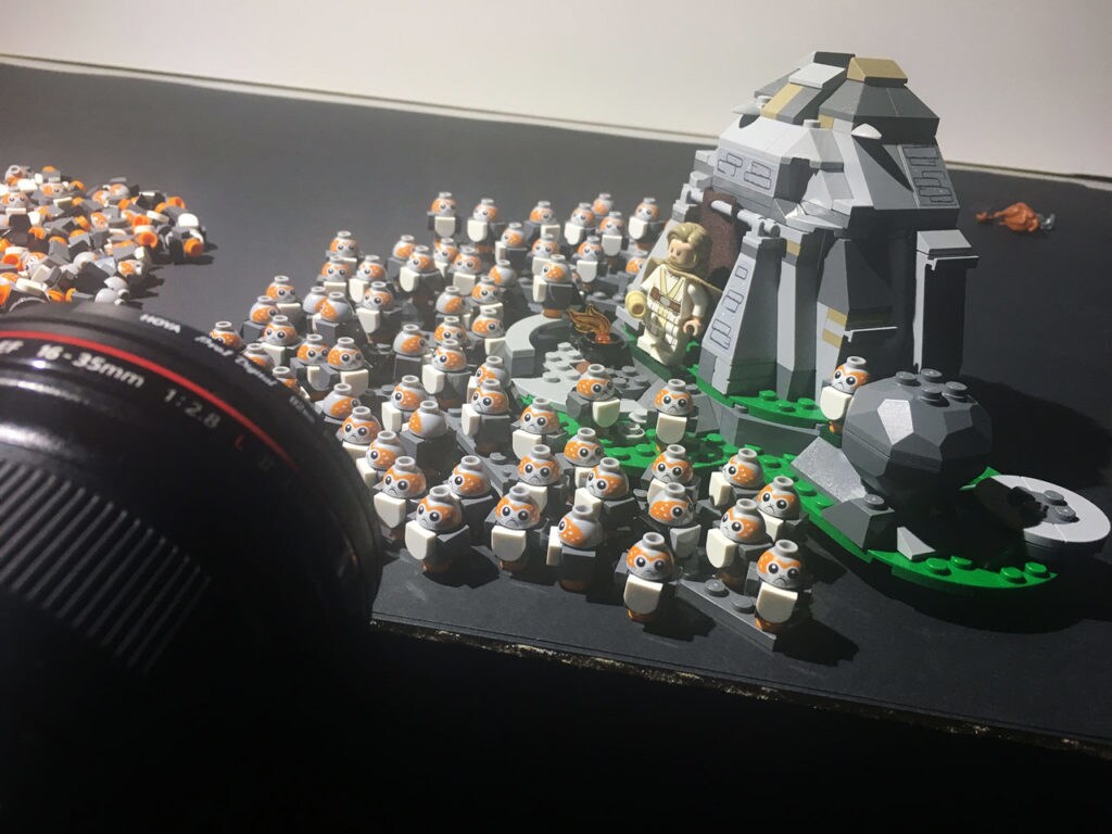 Lego porgs surround a Lego Luke Skywalker.
