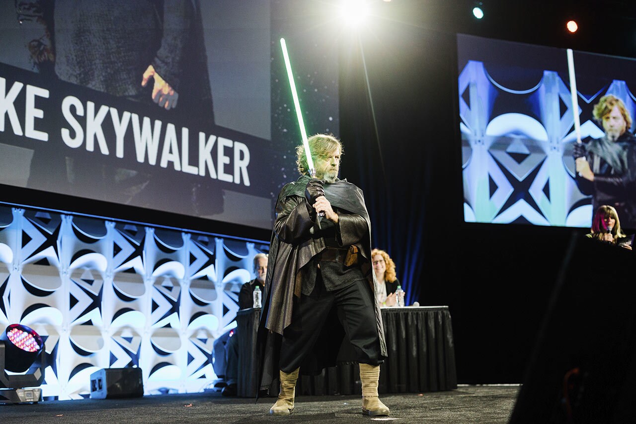 A Luke Skywalker cosplayer on stage at the Cosplay Competition