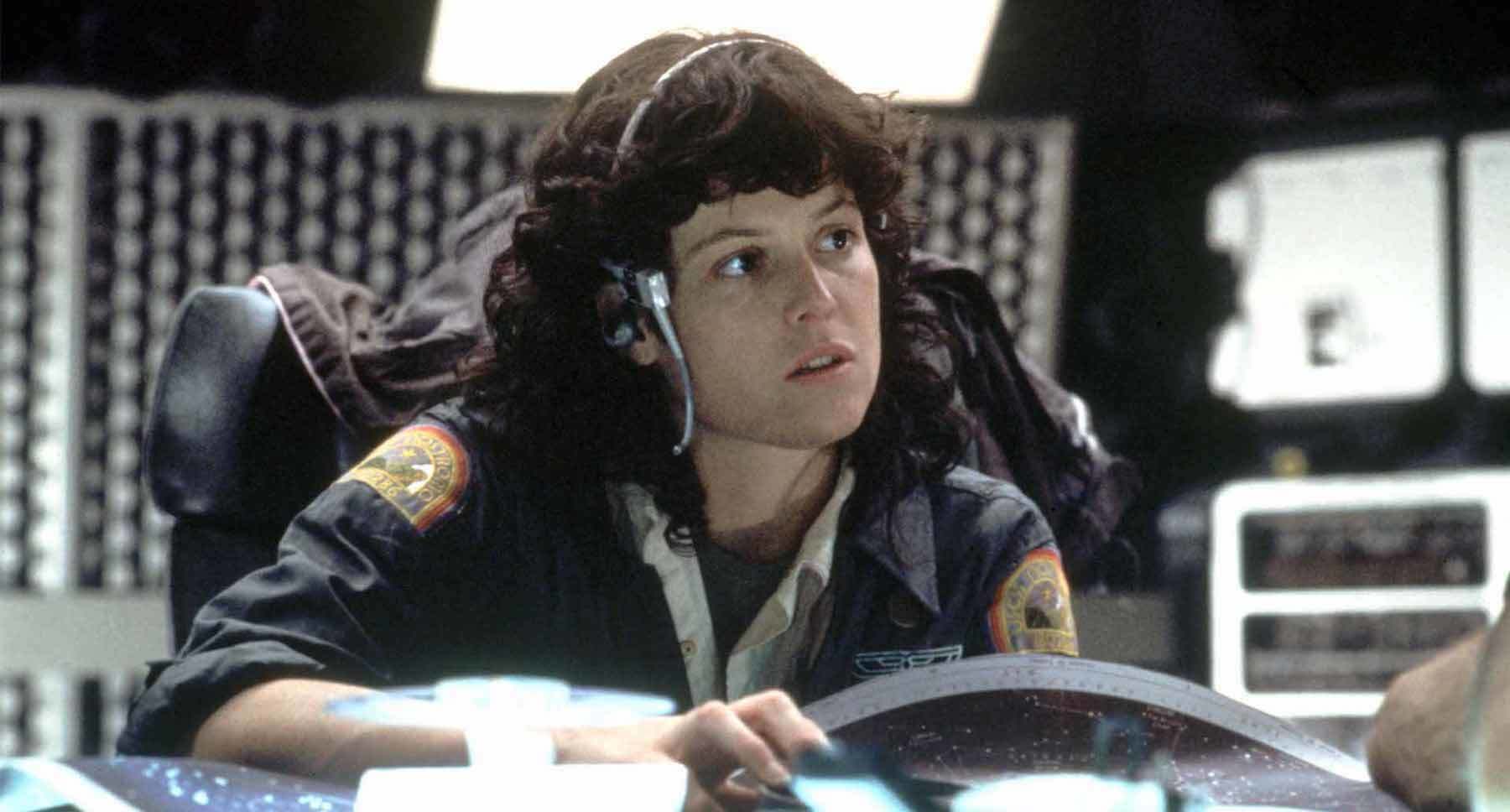 Ripley (actor Sigourney Weaver) sitting at a computer station in the movie "Alien."