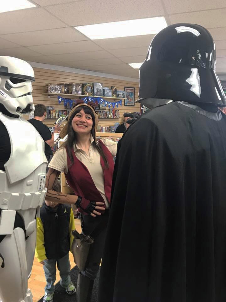 Doctor Aphra cosplayer Bria LaVorgna, with stormtrooper and Darth Vader cosplayers.