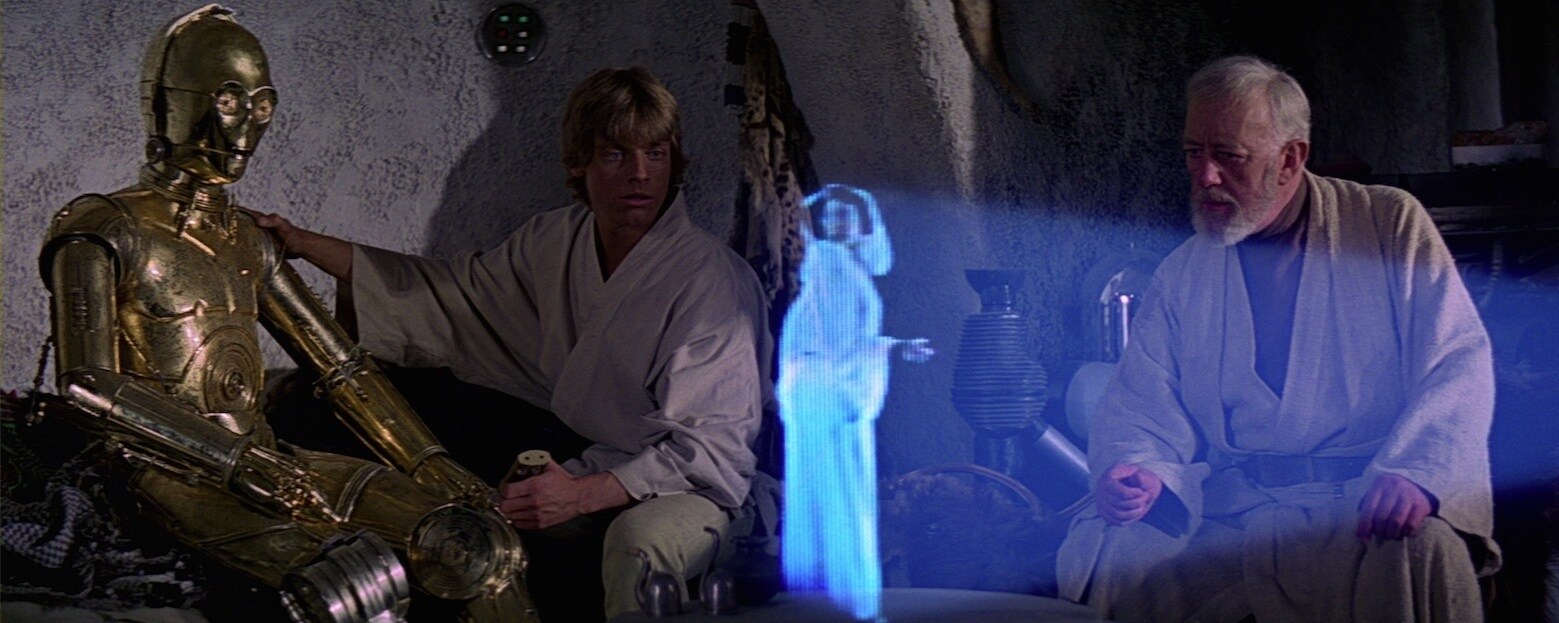 Luke Skywalker and Obi-Wan Kenobi watching Leia Organa's distress message
