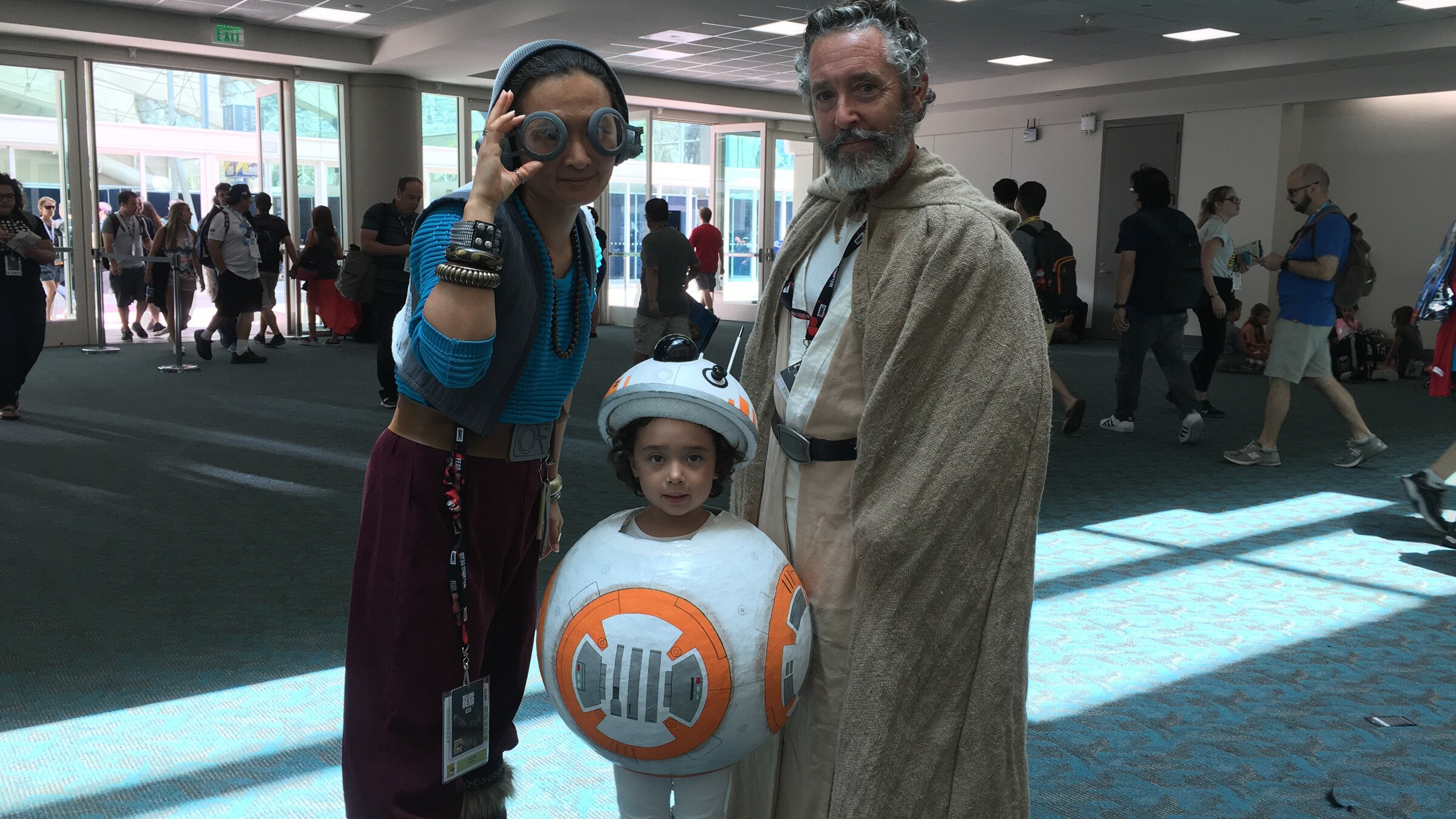 A Family cosplays as Maz Kanata, BB-8, and Obi-Wan Kenobi at San Diego Comic Con 2016.