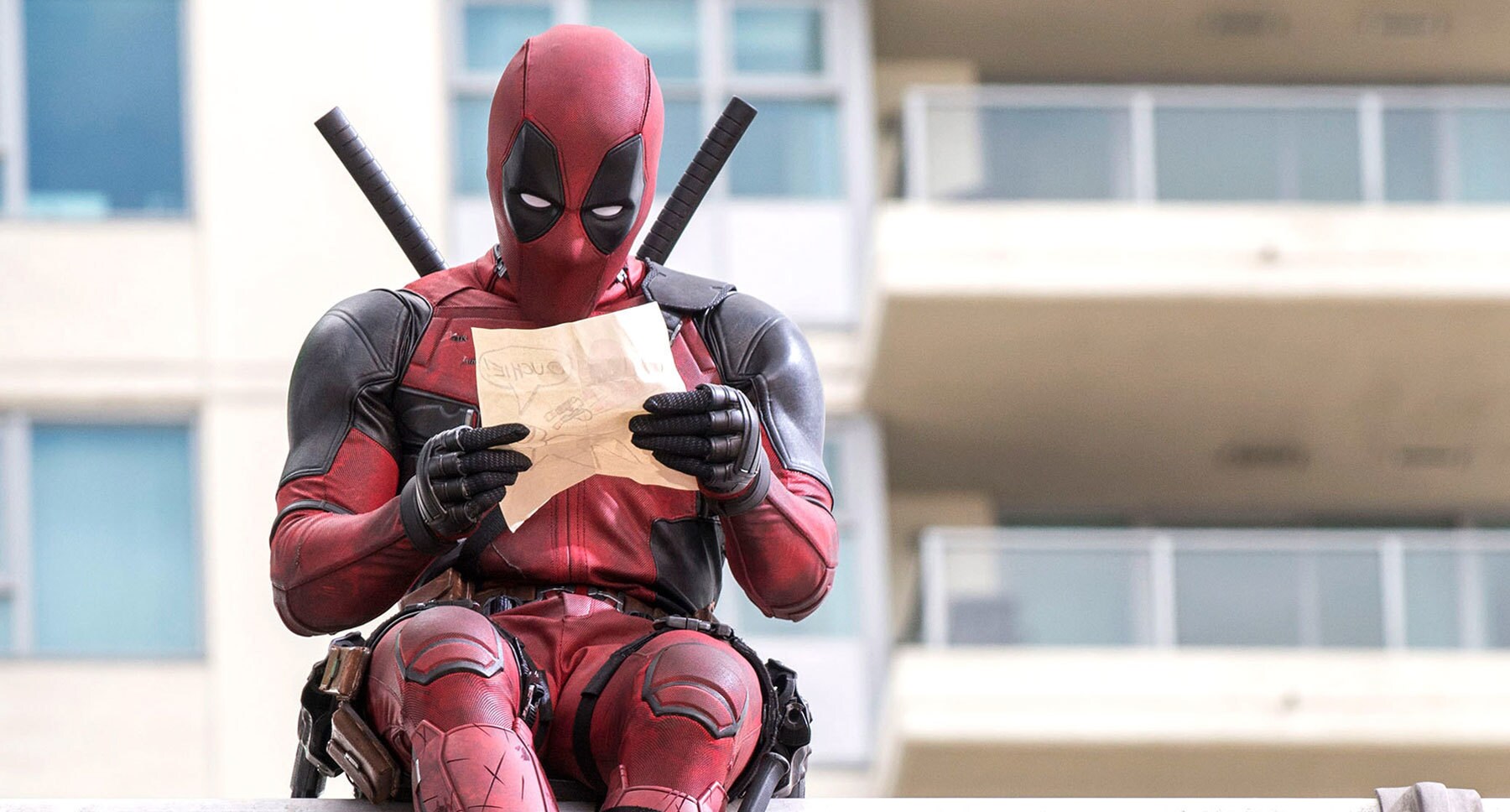 Ryan Reynolds (Deadpool) reading a letter in "Deadpool"