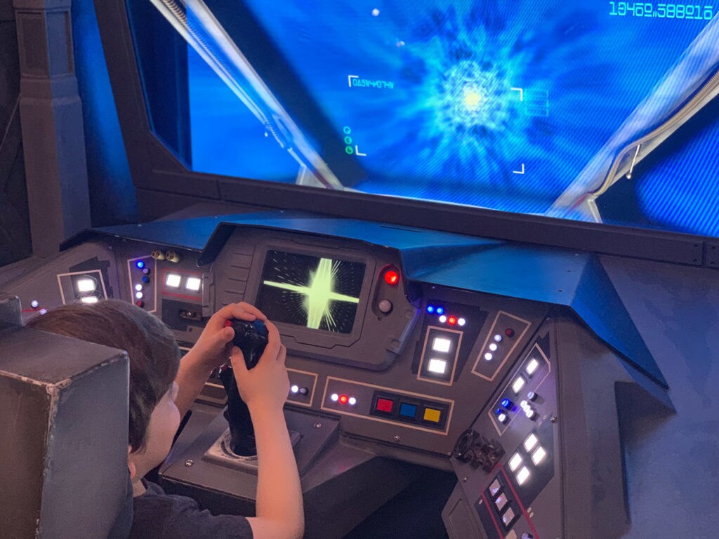 A young fan in the Star Wars Command Center on the Disney Fantasy from Disney Cruise Line.