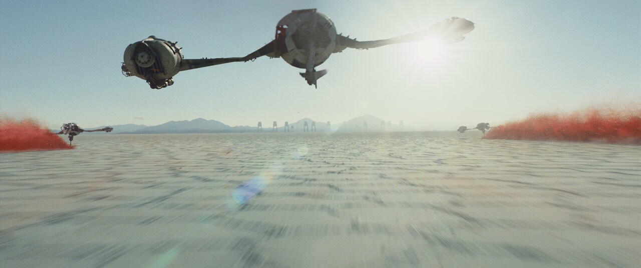 A ski speeder flies over the surface of the planet Crait in The Last Jedi.