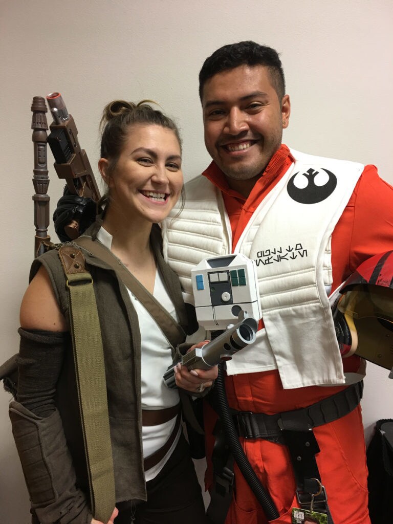 Cosplayers Salina and David Lopez dressed as Rey and Poe Dameron.