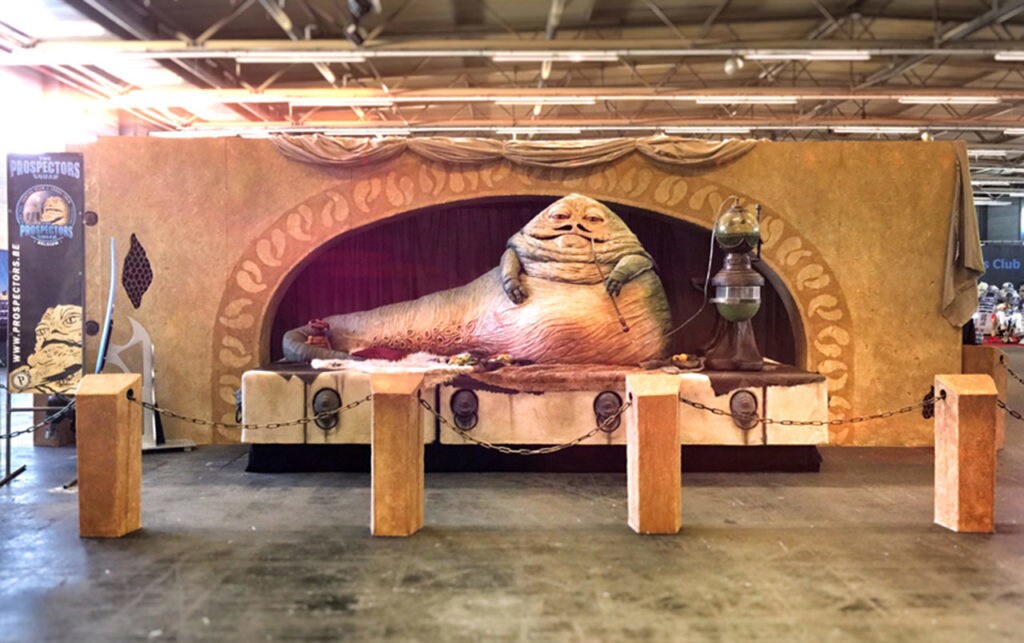 A fan made replica of Jabba the Hutt sitting in his palace at Star Wars Celebration Orlando.