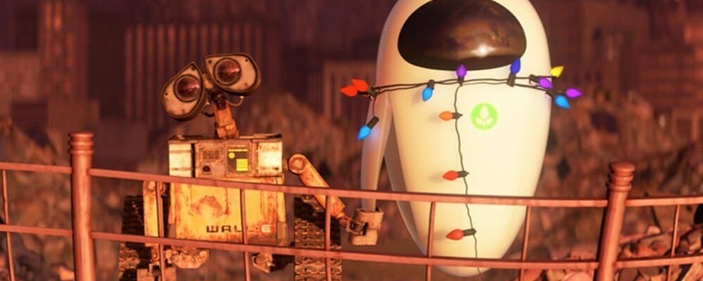 WALL-E holds a sleeping EVE's hand.