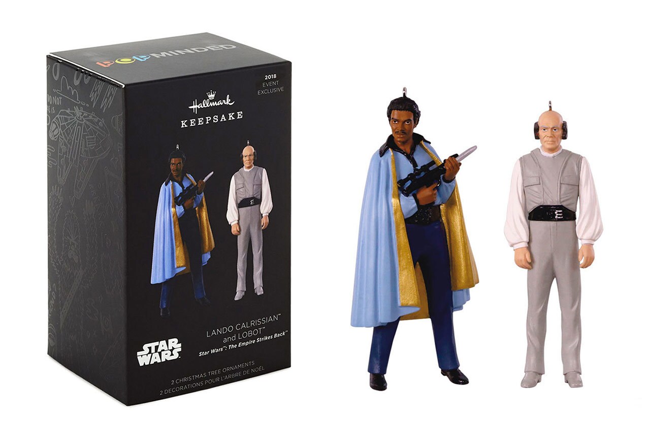 Lando Calrissian and Lobot Christmas Tree ornaments stand beside the box from which they came.