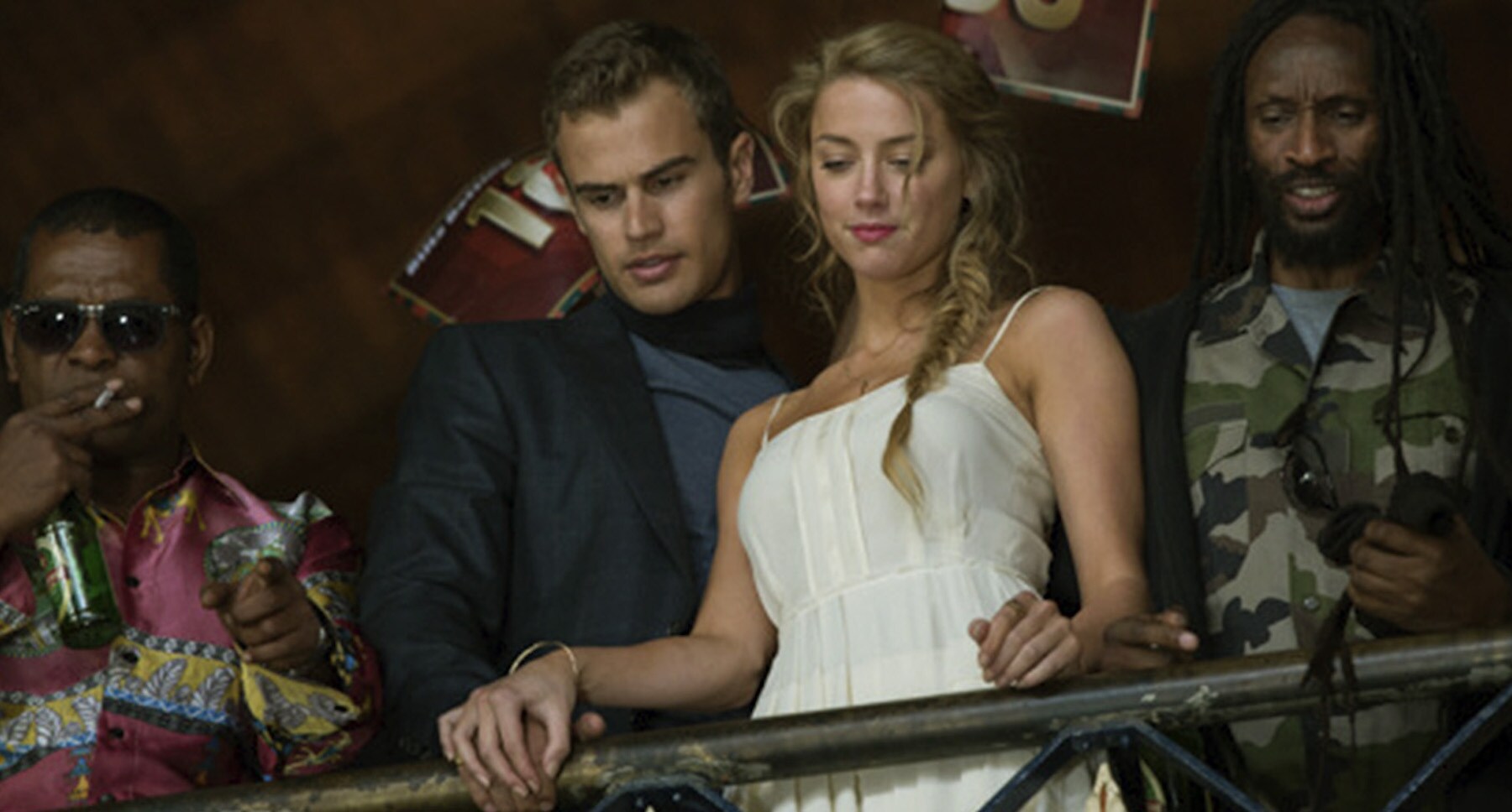 Jim Sturgess (as Keith Talent) and Amber Heard (as Nicola Six) standing on a balcony in "London Fields"