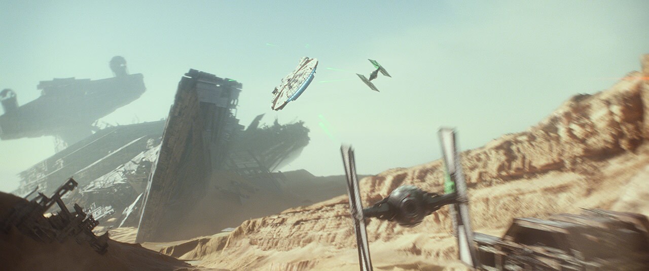 The Millennium Falcon is chased by TIE fighters on Jakku in The Force Awakens.
