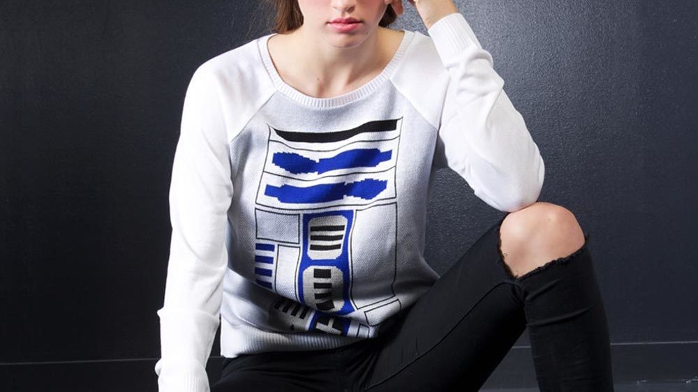 A women models an R2-D2 long sleeve shirt.