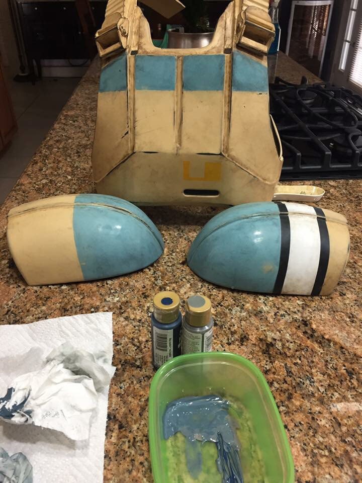 Several parts of an unfinished shoretrooper cosplay costume sit on a kitchen counter waiting for assembly.